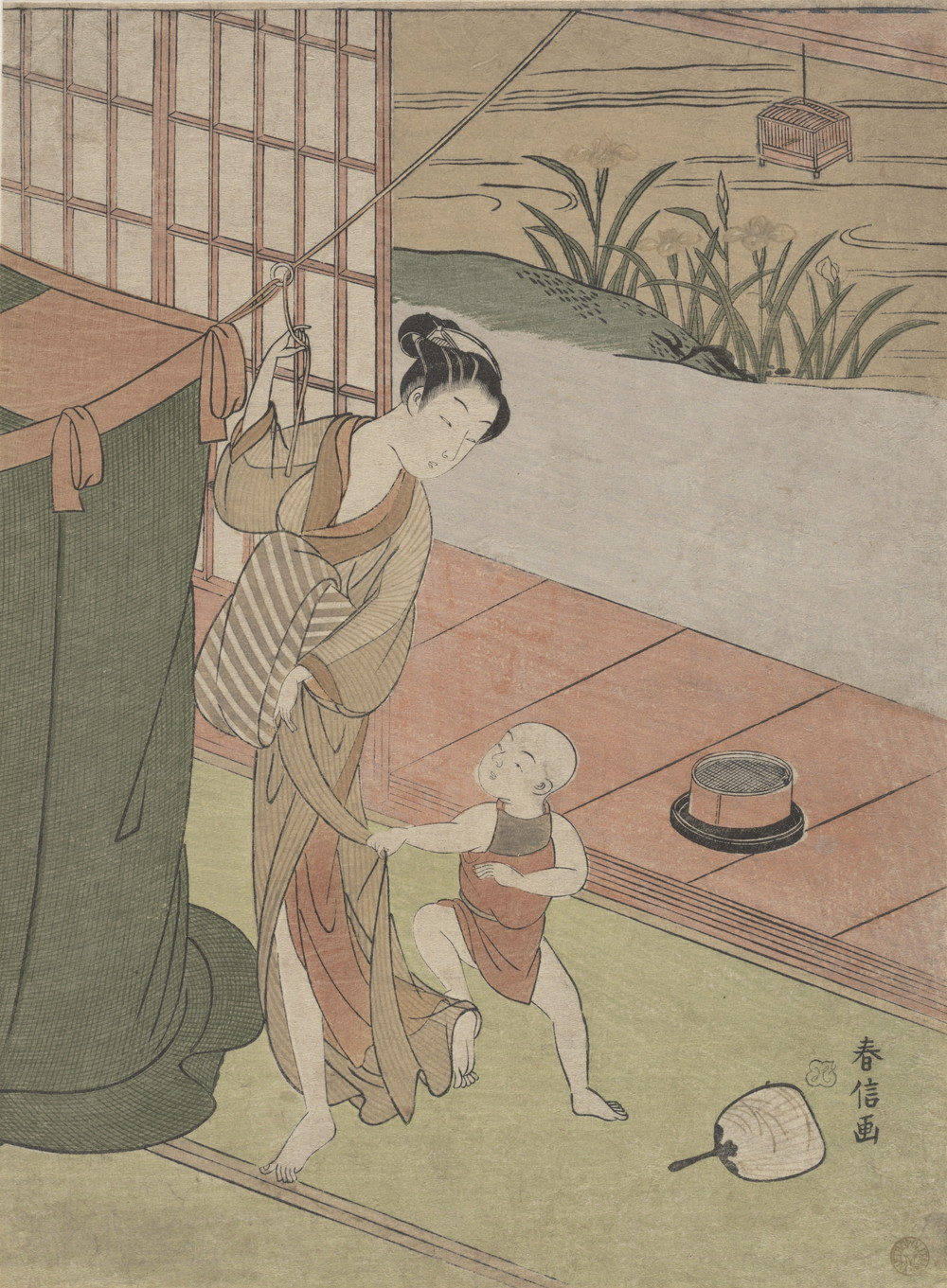 蚊帳を吊る母と子